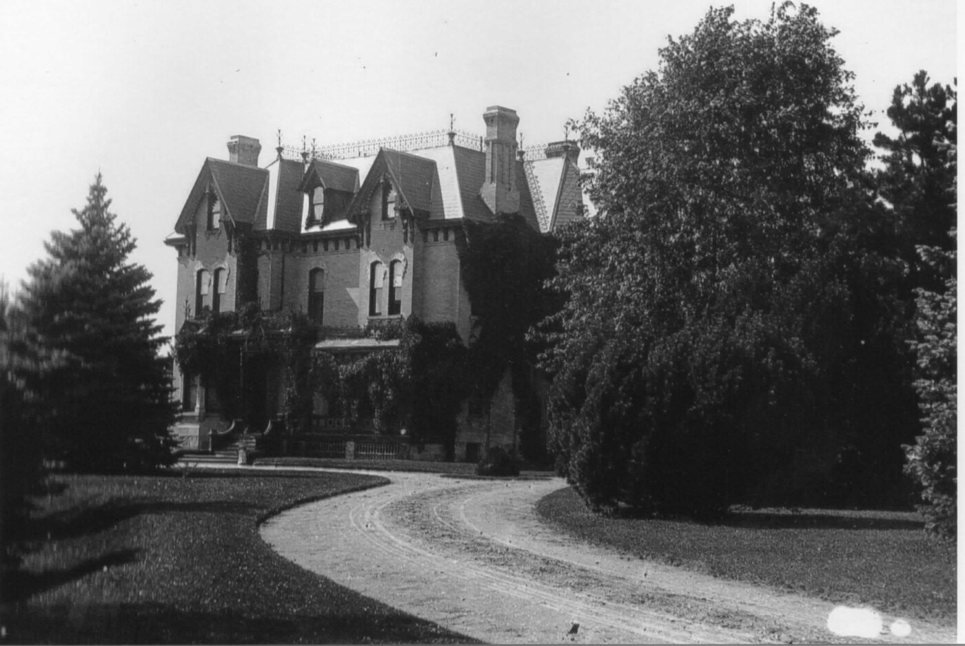 A side and driveway view of The Gore mansion